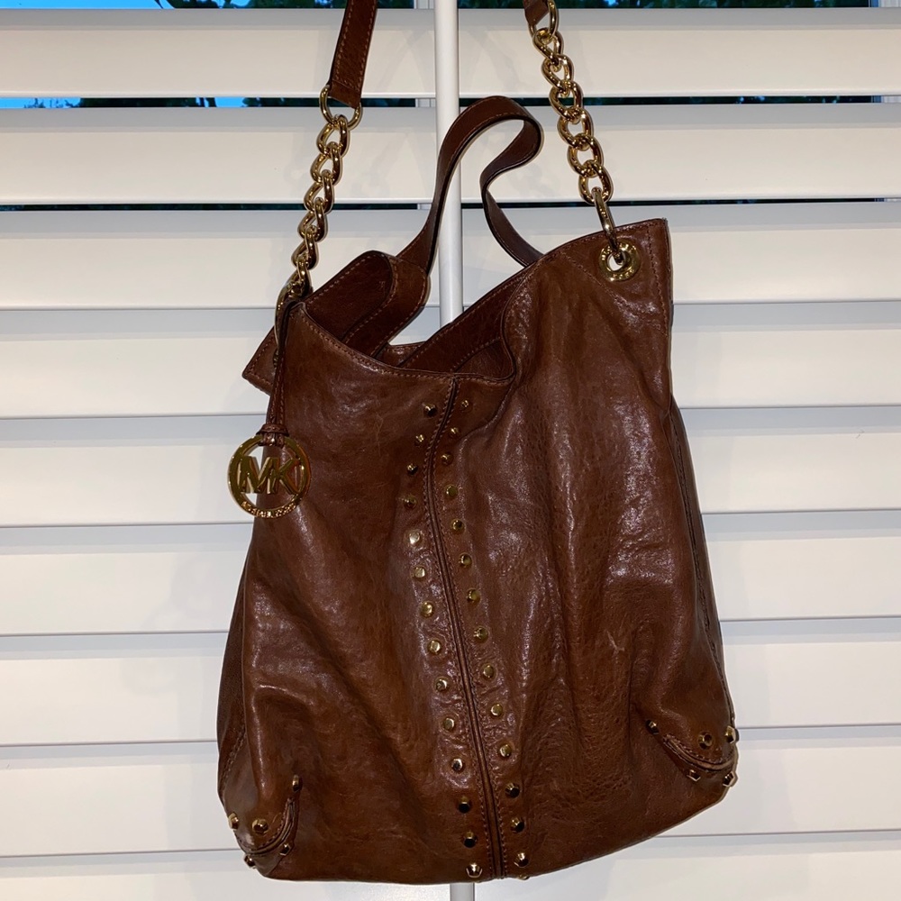 Gold studded Michael Kors shoulder bag.